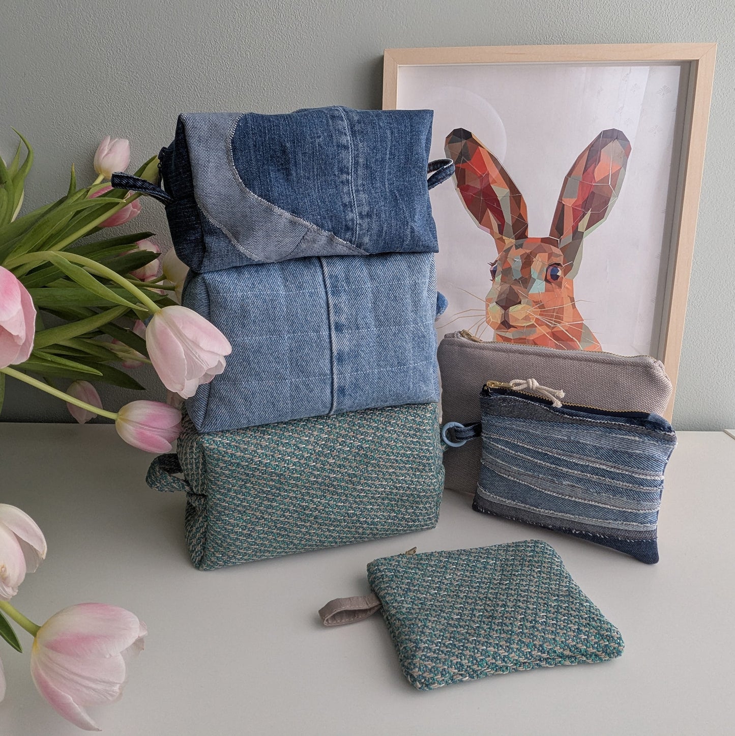 Blue medium cosmetic bag made from upcycled jeans